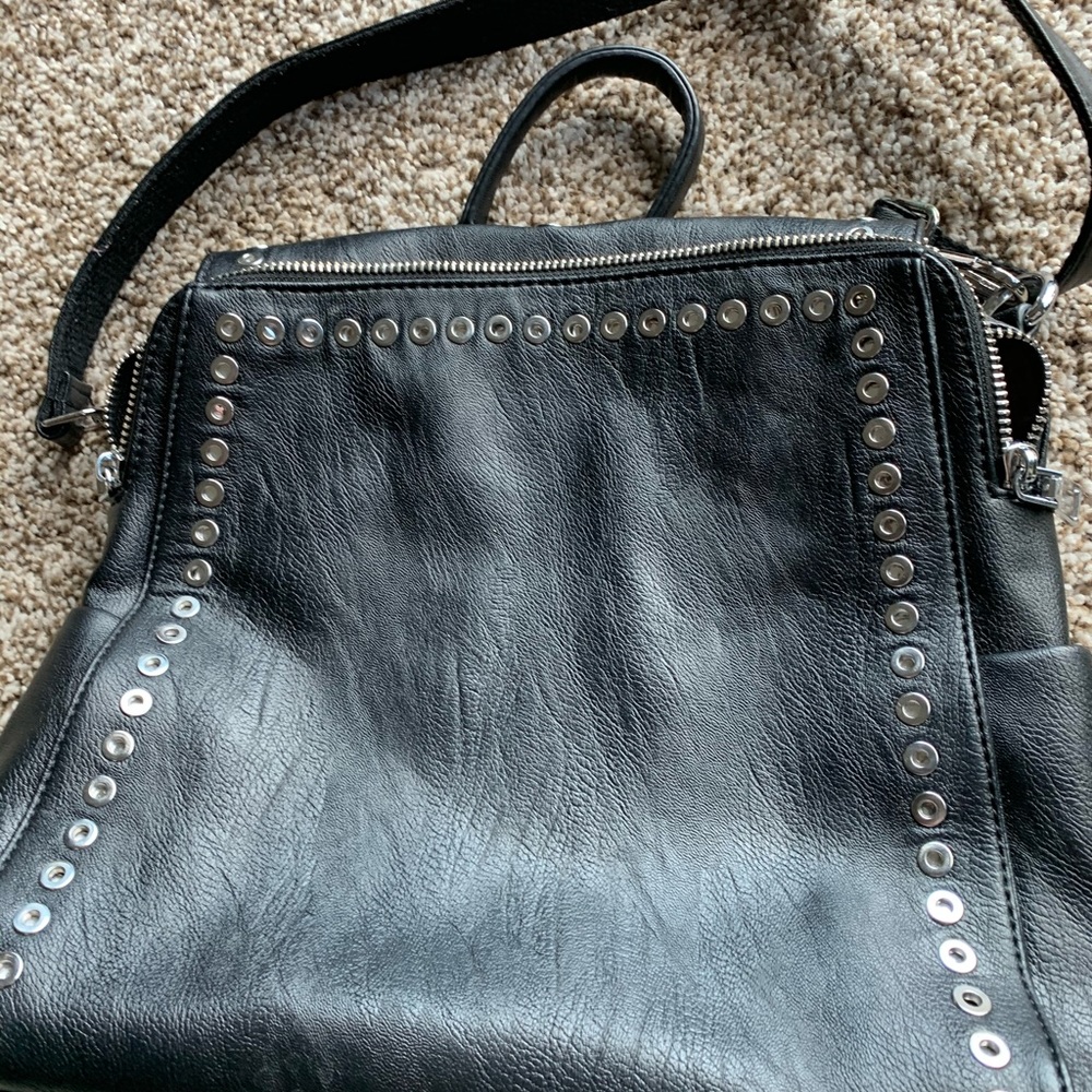 Black grommet backpack